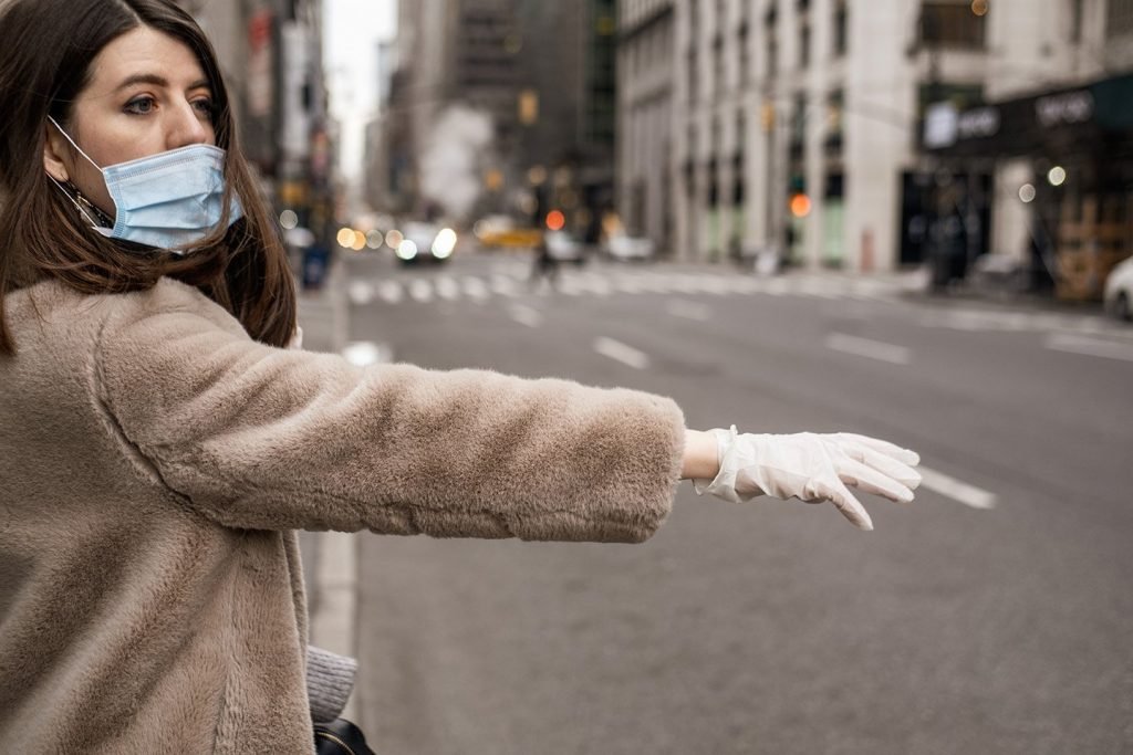 Woman wearing medical mask and gloves virus protection
